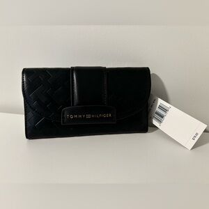 Never used. Tommy Hilfiger wallet (retail price is 78)